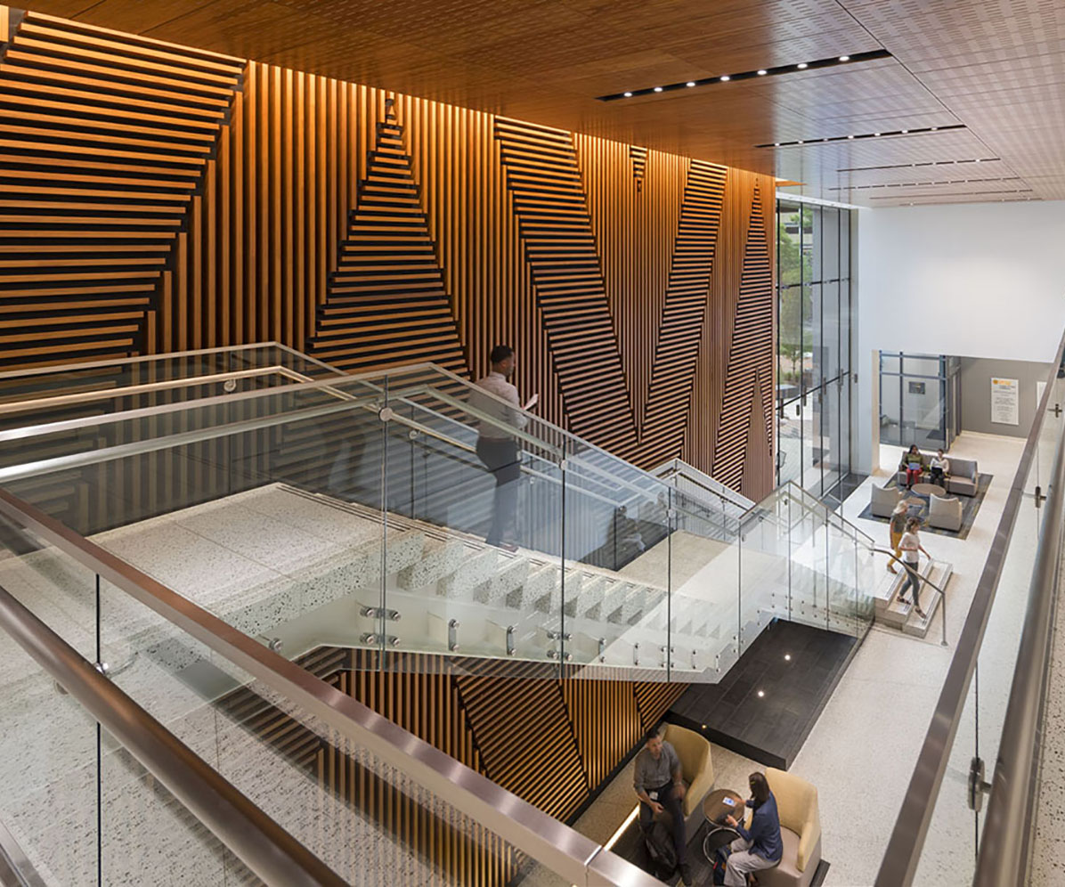 The lobby of the new building is a welcoming space where students can relax and study.